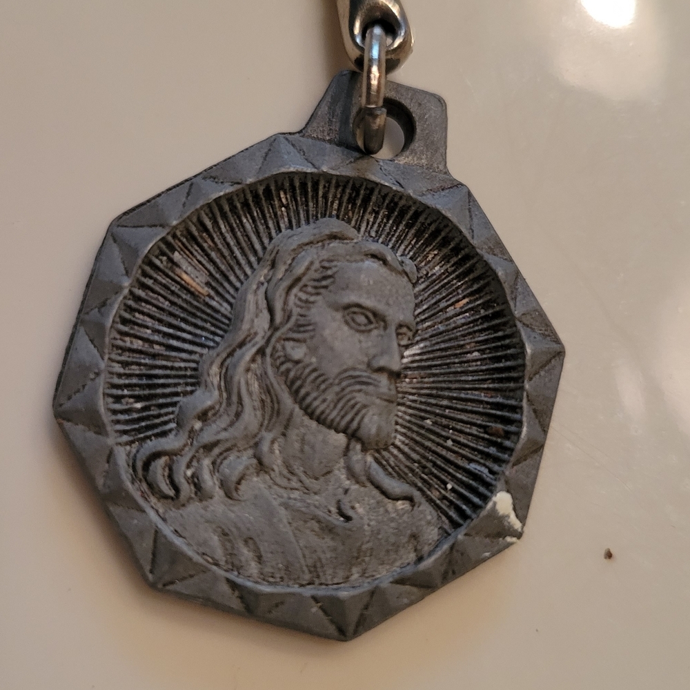 Unique and Vintage Keychain with Jesus's face on one side and transportation